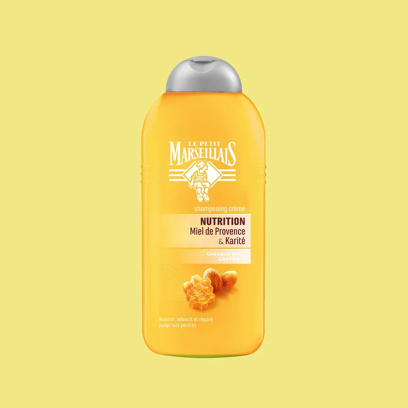 Le Petit Marseillais Nutrition cream shampoo bottle with its reworked label: Provence honey and shea for dry, brittle hair, on yellow